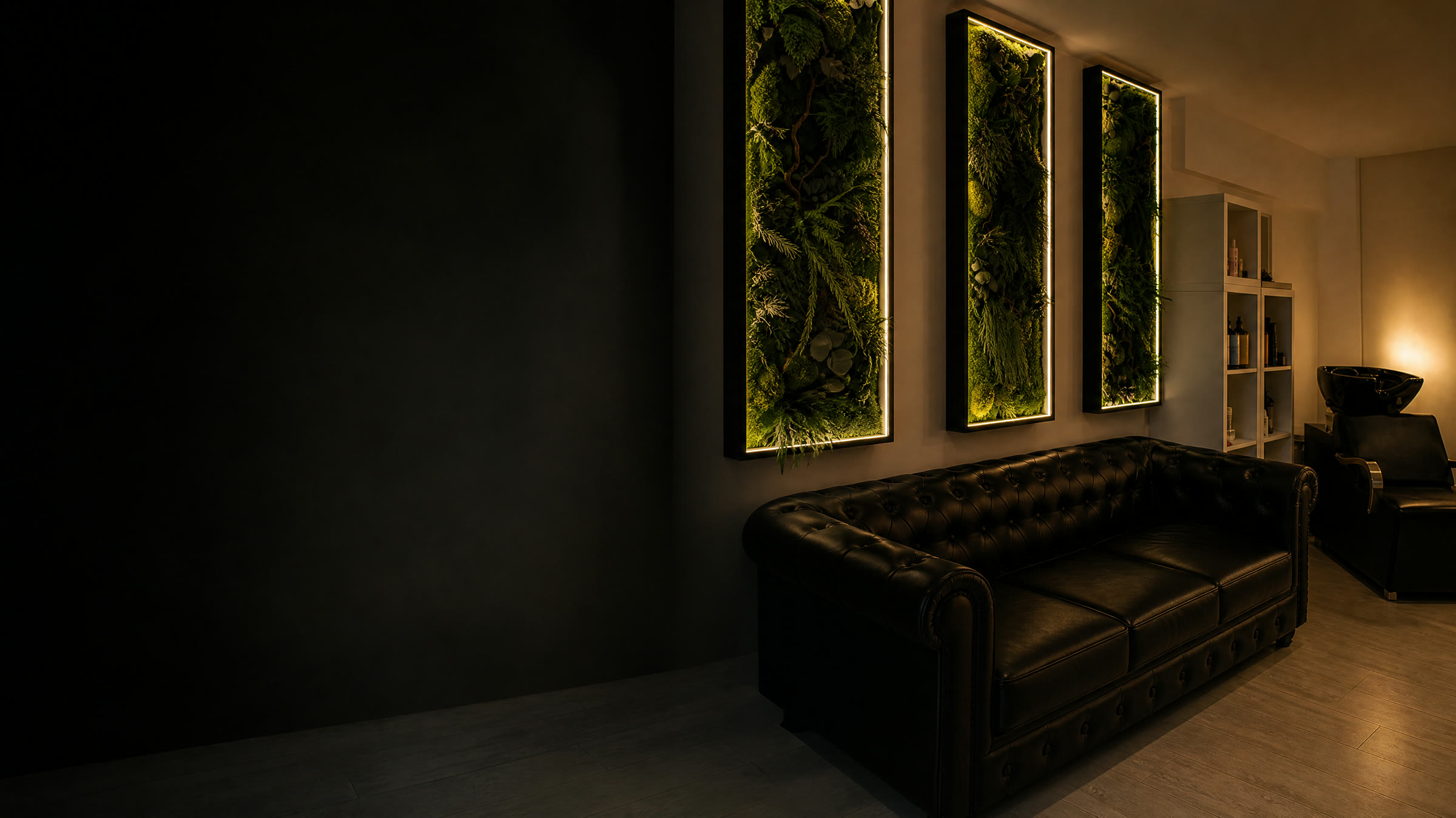 AVA Beauty Lux Lounge interior with living green wall panels and black chesterfield seating